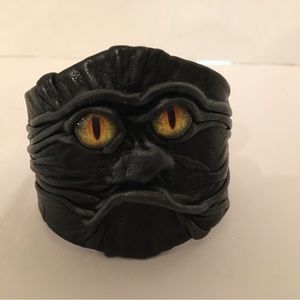 Leather Molded Cuff Bracelet with inset yellow glass eyes.